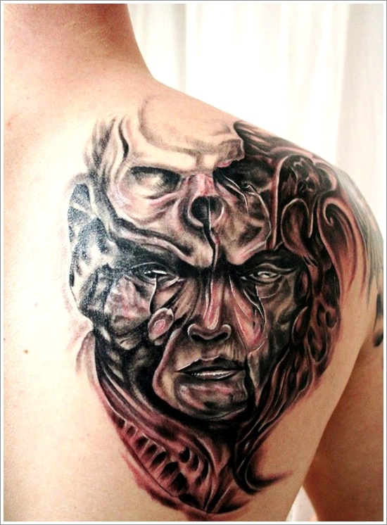 Black And Grey Skull On Face Evil Tattoo On Right Back Shoulder