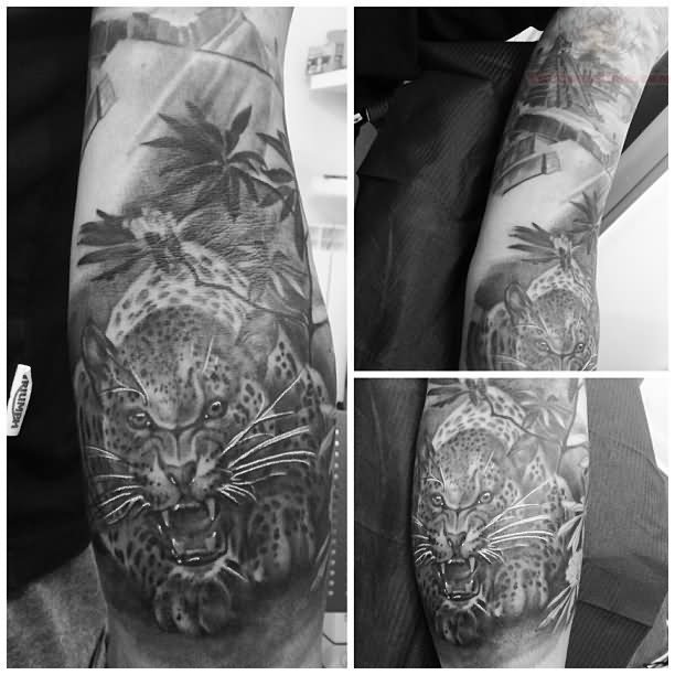 Black And White Angry Jaguar With Leaves Tattoo On Left Full Sleeve