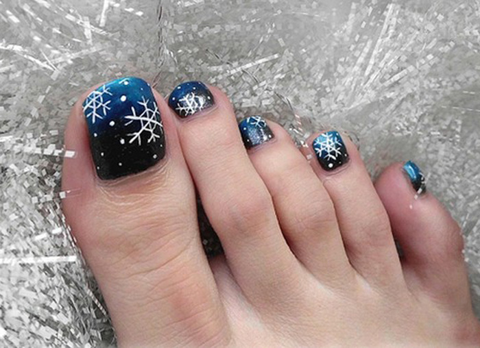 Blue And Black Ombre Nails With White Snowflakes Design Toe Nail Art