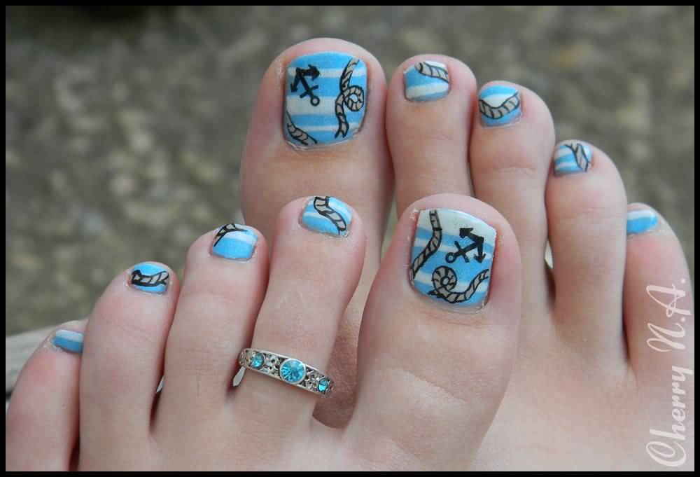 Blue And White Stripes Toe Nail Art With Nautical Signs