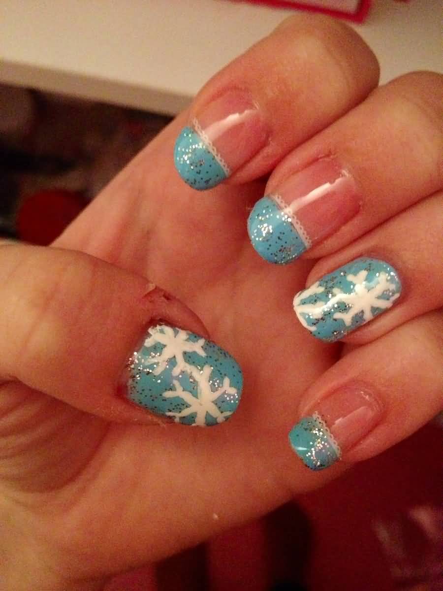 Blue Glitter Nails With White Snowflakes Winter Nail Art