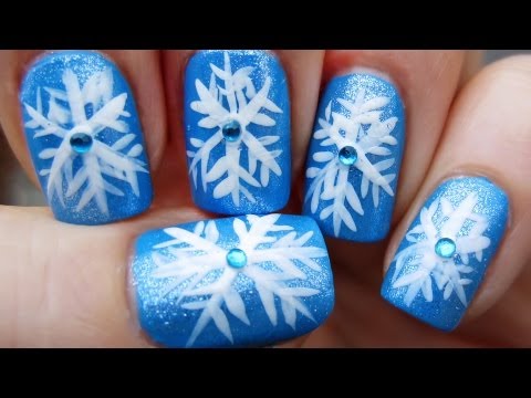 Blue Nails With White Snowflakes Winter Nail Art With Rhinestones Design