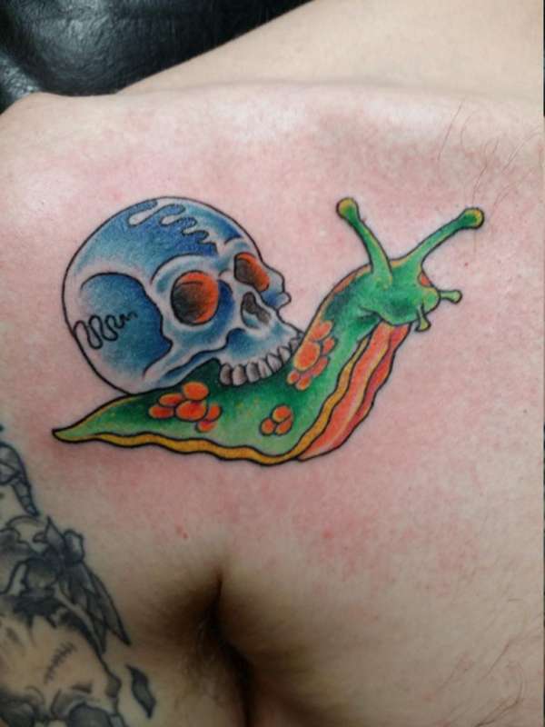 Blue Skull On Snail Back Traditional Tattoo On Left Shoulder