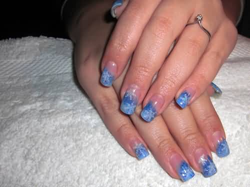 Blue Tip Nails With White Snowflakes Winter Nail Art