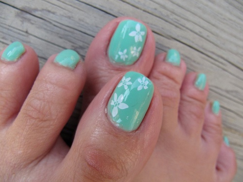 Blue Toe Nails With White Flowers Nail Art