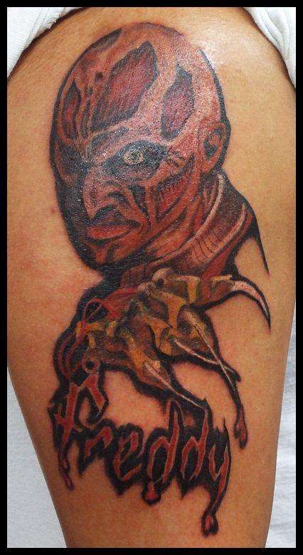 Color Ink Freddy Krueger Without Hat And Word Tattoo