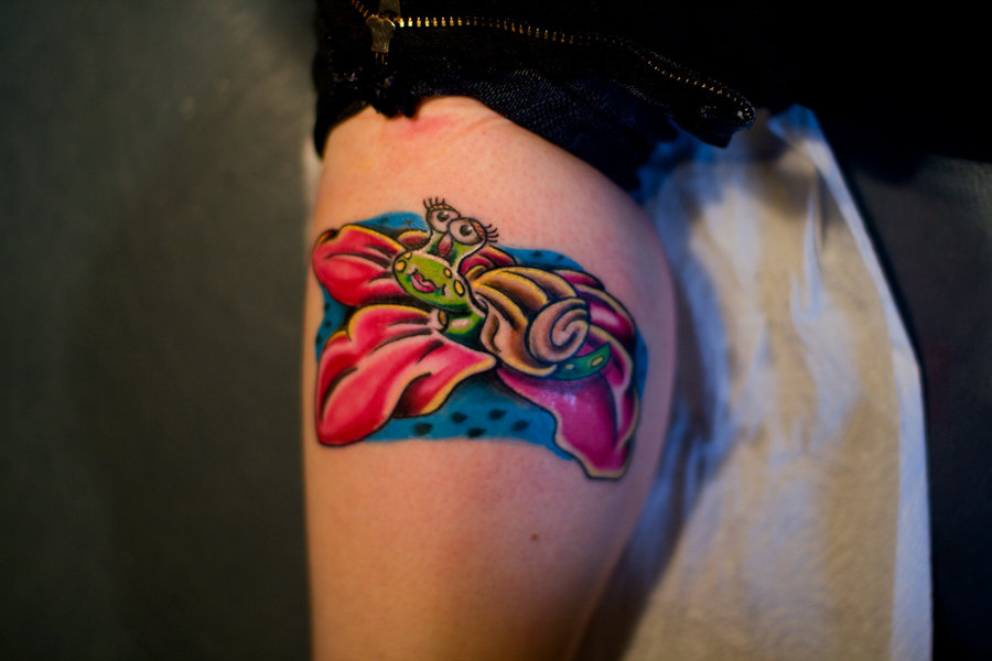 Colored Ink Cute Girl Snail On Flower Tattoo On Leg