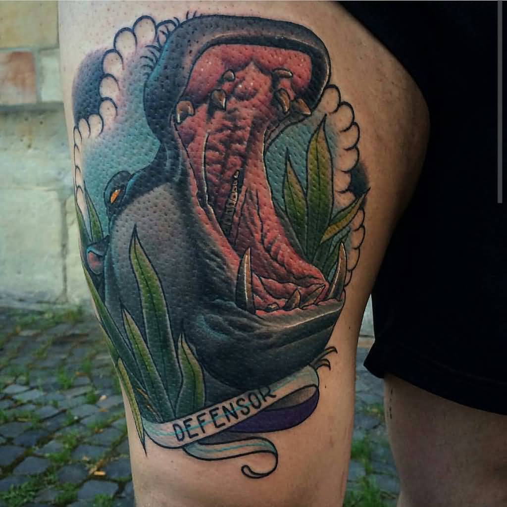 Colorful Angry Hippo Head With Banner Tattoo On Thigh