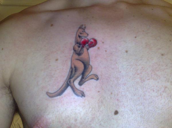 Cute And Small Boxer Kangaroo Tattoo On Chest