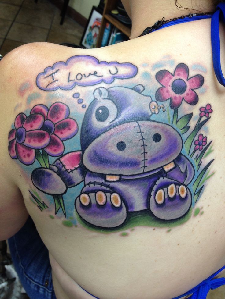 Cute Hippo With Flowers And I Love U Words Colored Tattoo On Back Left Shoulder