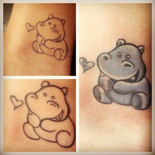 Cute Little Hippo Staring At Heart Shape Tattoo
