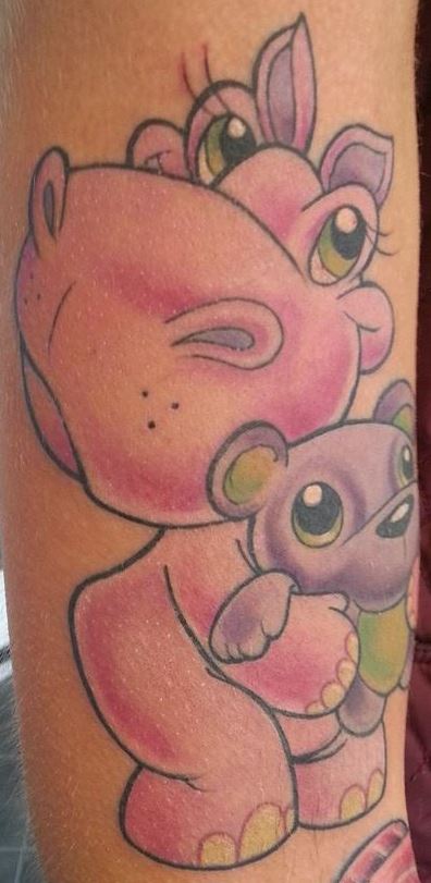 Cute Pink Cartoon Hippo With Teddy Bear Tattoo