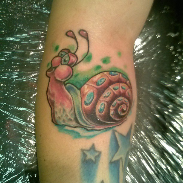 Cute Snail Munching With Stars Colored Tattoo