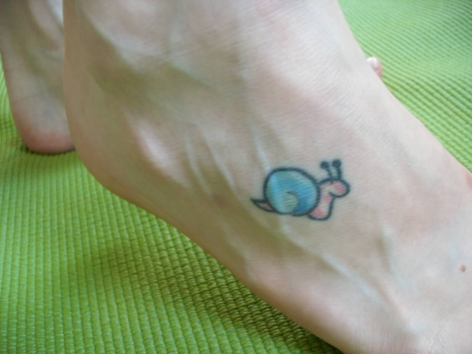 Cute Snail Smiling Small Tattoo On Foot