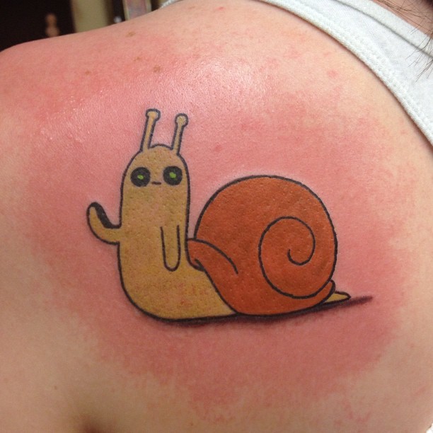Cute Snail Tattoo On Left Back Shoulder