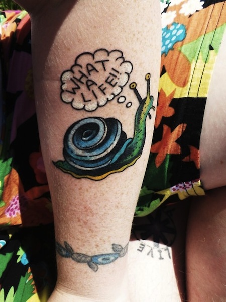 Cute Snail With What A Life Words Tattoo On Forearm