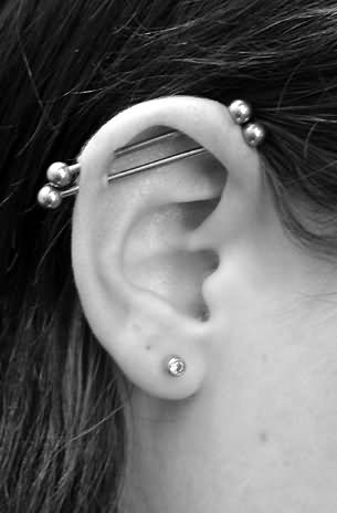 Double Industrial Piercings With Silver Barbells