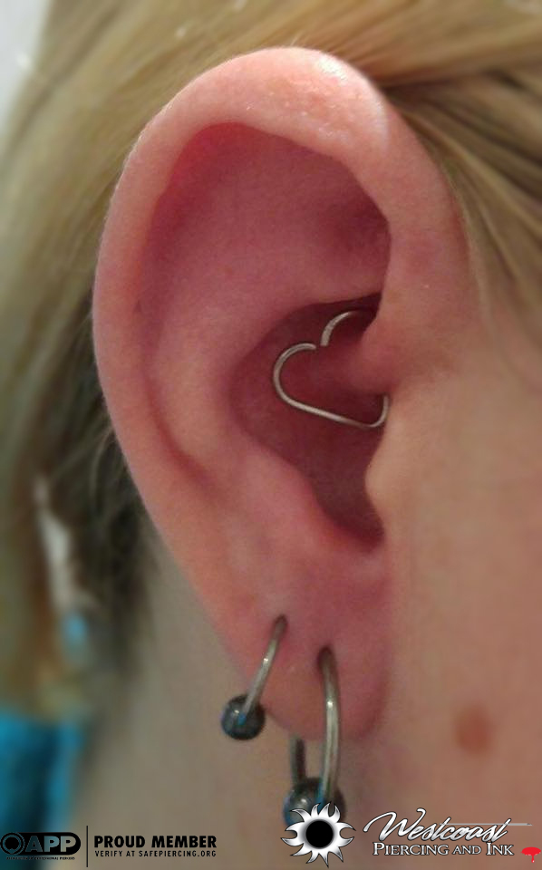Double Lobe And Daith Piercing With Heart Shape Ring