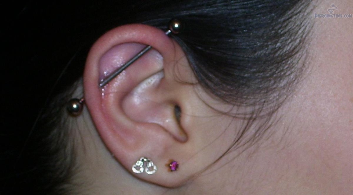 Dual Ear Lobe And Industrial Piercing For Young Girls