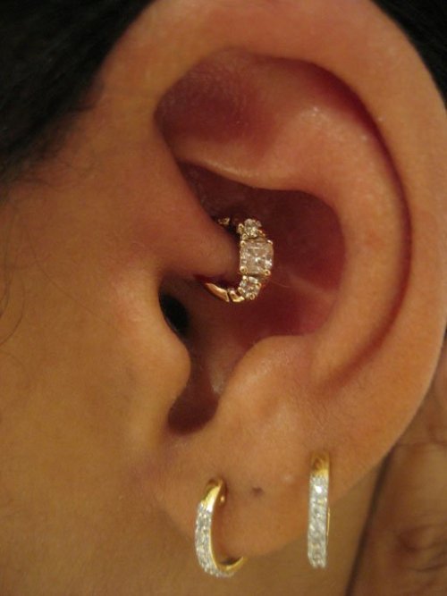 Dual Lobe And Daith Piercing On Left Ear
