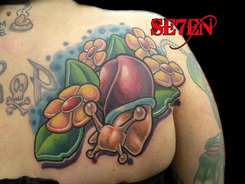 Extremely Beautiful Snail With Flowers Tattoo