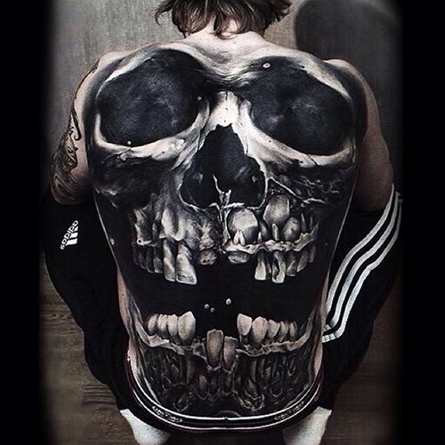 Fabulous Black And Grey Evil Skull Laughing Tattoo On Full Back