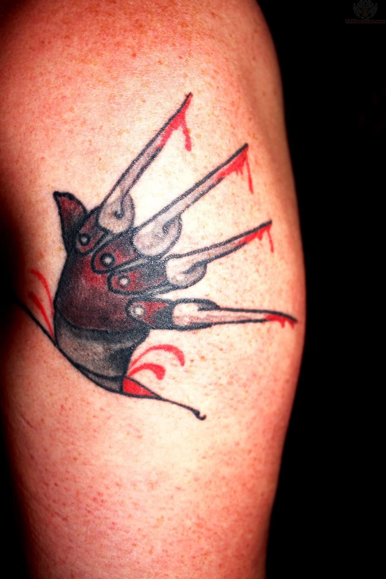 Freddy Krueger Glove Ripped Skin Traditional Tattoo.