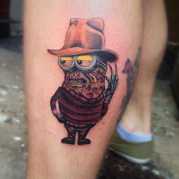 Funny Grey Minion In Freddy Krueger Style Tattoo On Back Leg