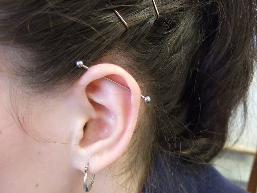 Girl Left Ear Lobe And Industrial Piercing