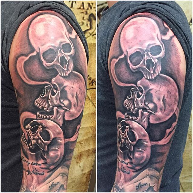 Grey And Black Evil Skulls Tattoo On Full Sleeve