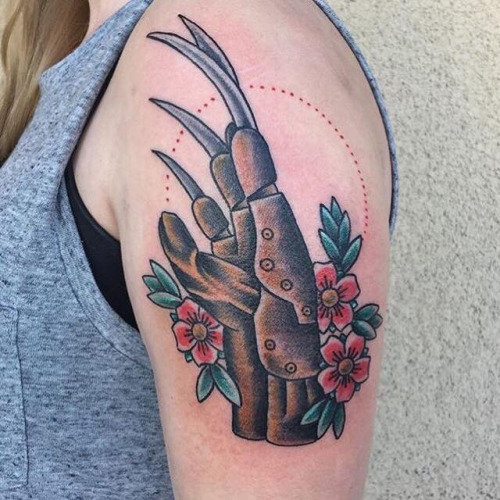 Grey Color Freddy Krueger Glove Traditional Tattoo On Left Shoulder
