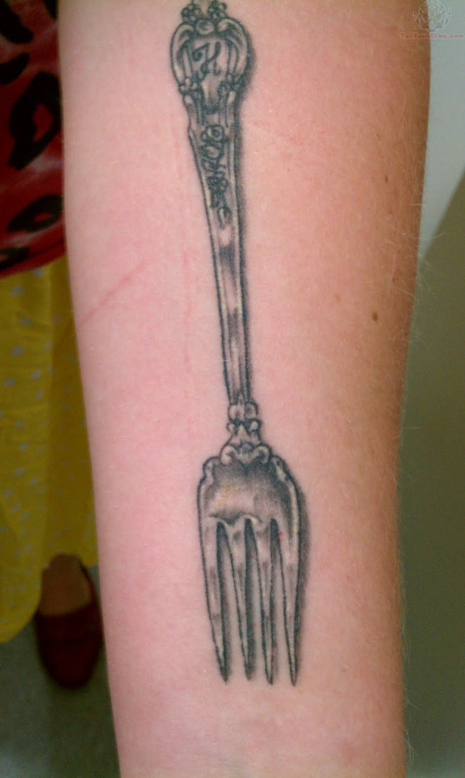 Grey Ink Fork Tattoo Design On Forearm