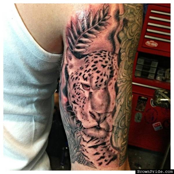 Grey Ink Jaguar With Leaves Tattoo On Right Half Sleeve By Louie Canjo Coronado