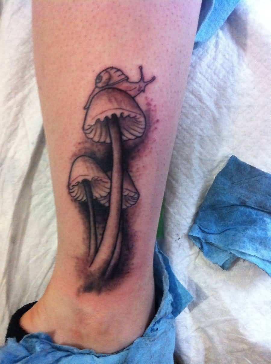 Grey Ink Snail On Mushroom Tattoo On Leg By Underdell