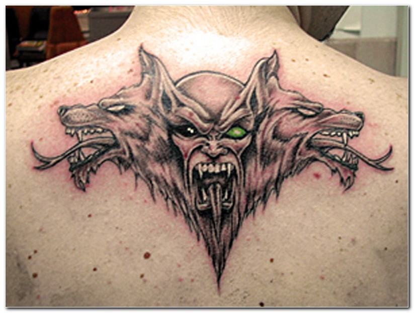 Grey Ink Wolfs And Evil Heads Tattoo On Upper Back