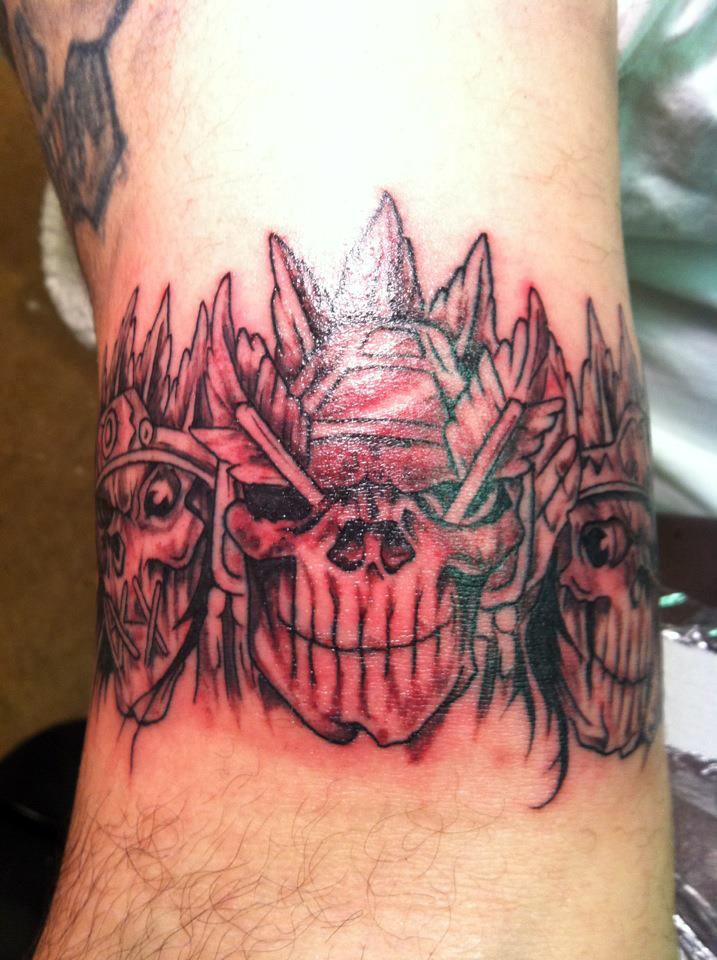 Grey Inked Skull With Arrows Tattoo