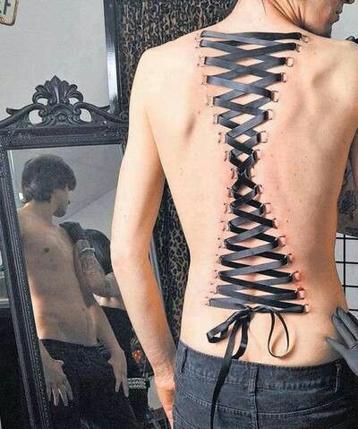 Guy With Corset Piercing On Back Body