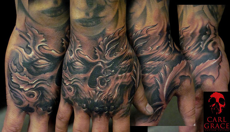 Incredible Grey And Black Evil Skulls Flaming Tattoo On Hand