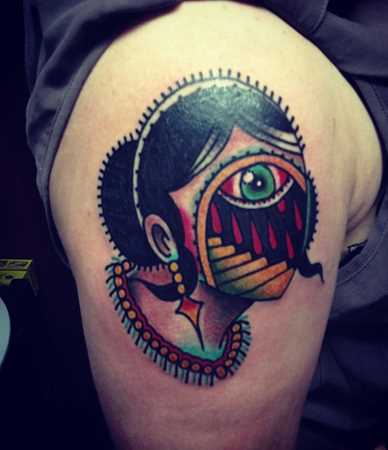 Lady Having Evil Eye Traditional Tattoo On Shoulder