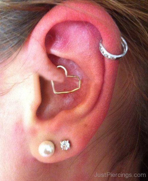 Left Ear Dual Lobe And Daith Piercing With Heart Ring