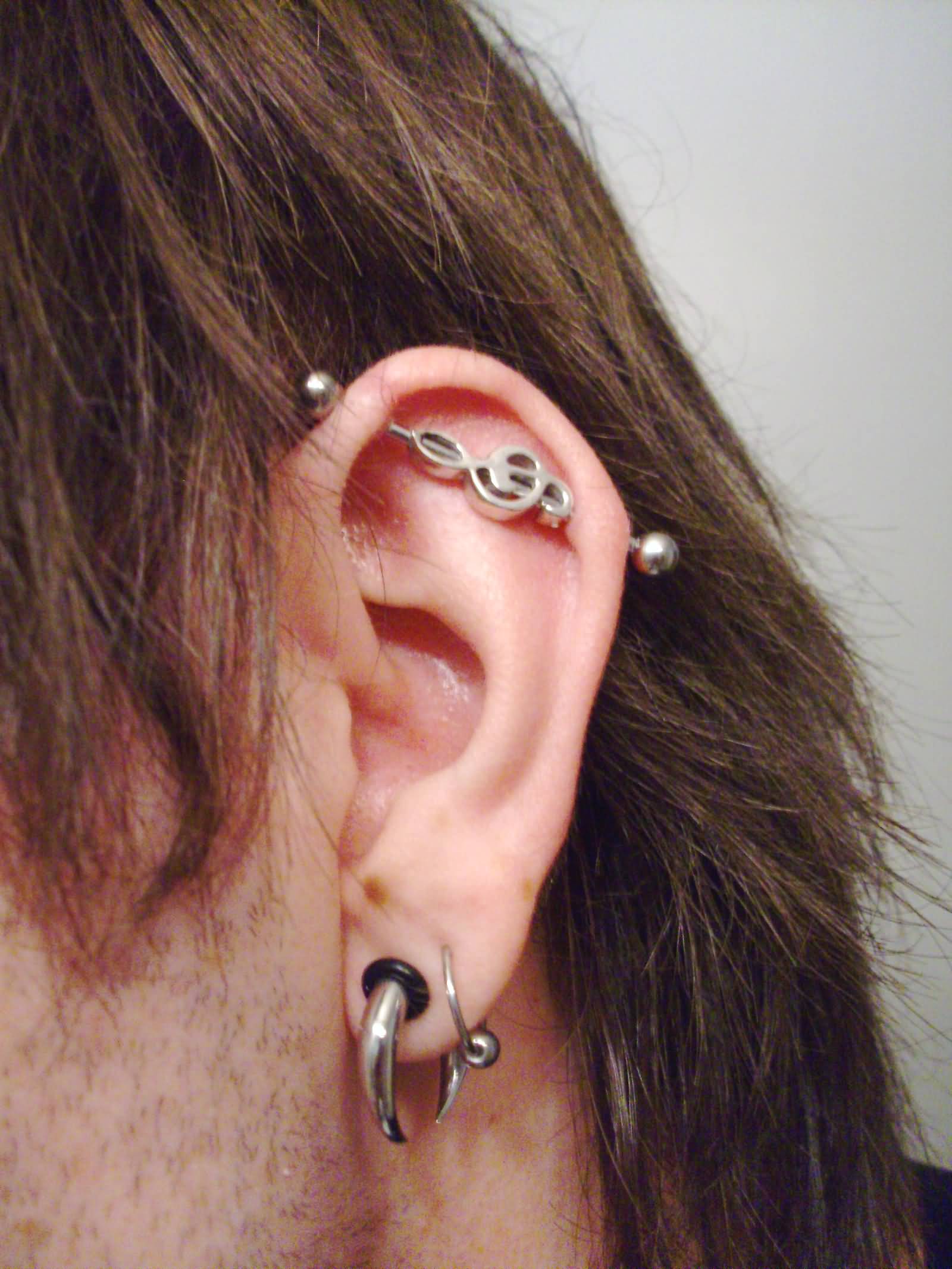 Left Ear Lobe And Industrial Piercing On Left Ear