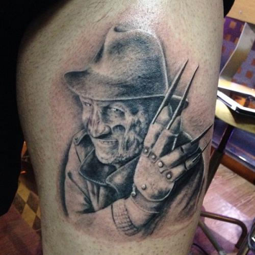 Light Grey Ink Freddy Krueger Tattoo On Thigh