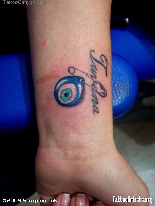 Lovely 3D Evil Eye With Word Tattoo On Wrist