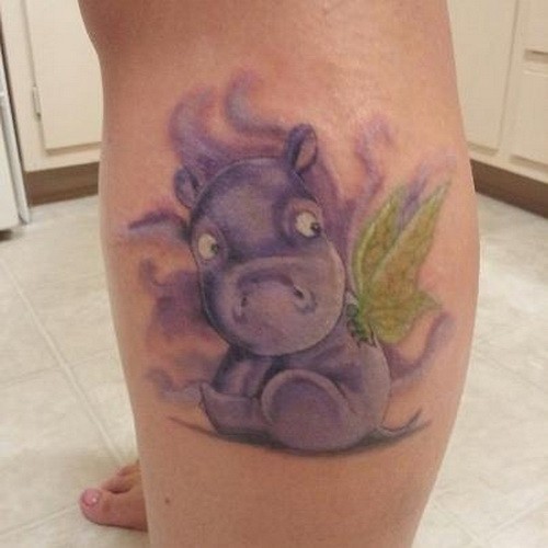 Lovely Cartoon Hippo Having Green Wings Tattoo On Left Leg
