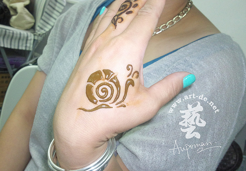 Lovely Henna Snail Tattoo On Hand