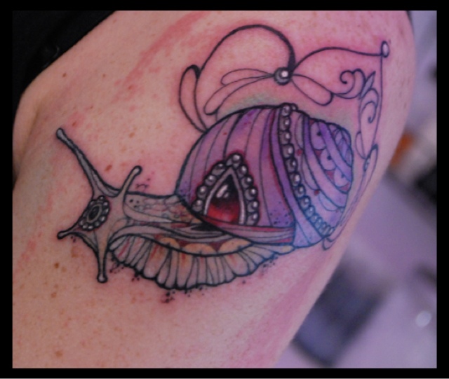 Lovely Purple Ink Snail Tattoo On Left Shoulder