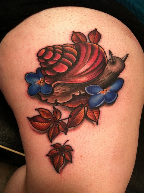 Lovely Snail With Flowers And Leaves Colorful Tattoo By Amanda Leadman