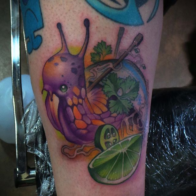 Marvelous Snail With Lemon Piece And Leaves Colorful Tattoo