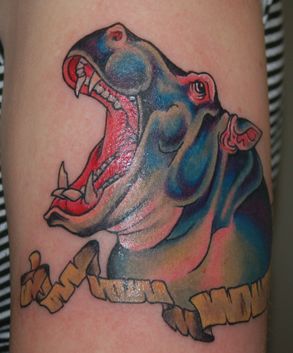 Nice Egyptian Hippo Opening Mouth With Banner Tattoo