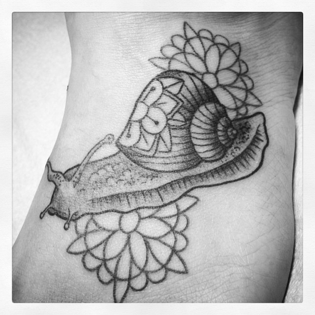 Nice Flowers With Snail Shell Black And White Tattoo